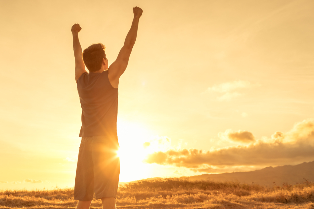 Stand,Strong.,Man,With,Fist,In,The,Air.,Feeling,Motivated,