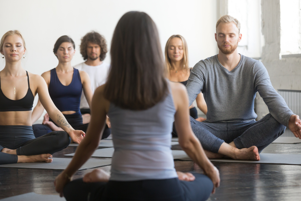 Group,Of,Young,Sporty,People,Practicing,Yoga,Lesson,With,Instructor,